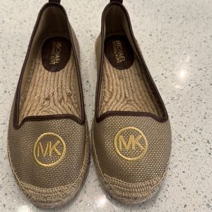 Great pair of Michael Kors 6 1/2 W espadrille slip on! Gently used minimal wear.